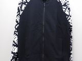a black jacket with white letters on it hanging on a hanger