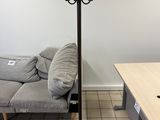 an image of a living room with a couch and a lamp