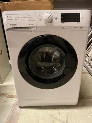 a washing machine that is sitting on the floor