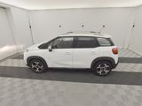 a picture of a white car parked in a garage