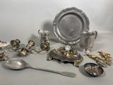 a lot of silver items that are on the table