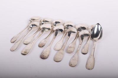 six spoons and a spoon rest on a white surface