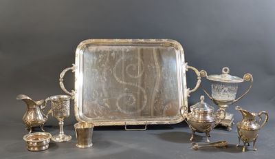 a silver tray with a silver tray and other silver items
