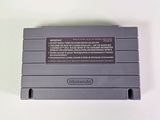 an old nintendo game console sitting on top of a white table