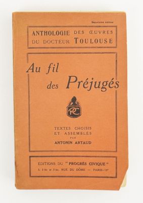 an old book with a picture of a man sitting on top of it