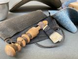 a pair of scissors and some other items on a table