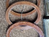 several pieces of wood are sitting on the floor next to a pair of scissors