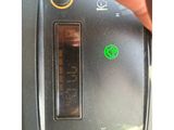 a close up of a person ' s finger pressing a button on a toaster