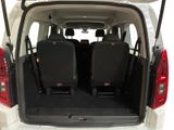 two seats in the back of a white van