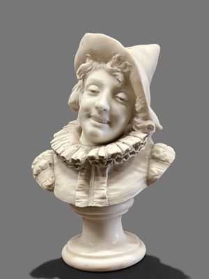 a white bust of a child with a hat on it
