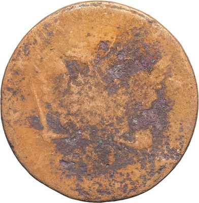 a close up of an old coin with rust on it