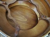 a close up of a wooden bowl on a table