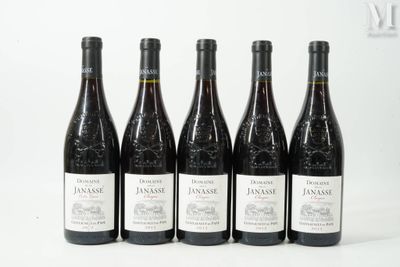 six bottles of wine are lined up in a row on a table
