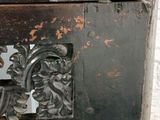 a close up of a metal table with a glass top