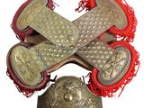 an image of a cross made out of metal and red fringes