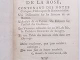 an old book with writing on it sitting on a table