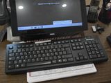 a laptop computer sitting on top of a wooden desk