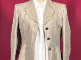 an image of a woman ' s jacket on a mannequin stand