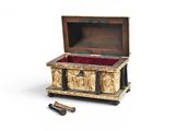 a small wooden chest with a red velvet lining inside of it