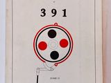 a white book with a red and black design on it