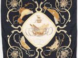 a black scarf with a picture of a horse and carriage on it