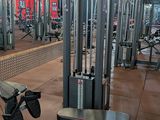 an image of a gym room with a bench and weights