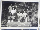 several old black and white photos of a group of people posing for a picture