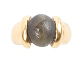 an image of a close up of a ring with a stone on it