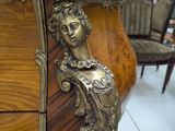 a wooden table with a statue on top of it
