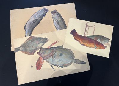 three cards with fish on them sitting on a table