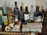 a basket with various bottles of alcohol on a table