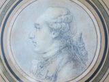 portrait of a man in profile, in a circular frame