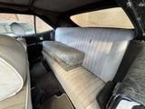 a car that has a lot of seats in the back of it