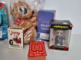 a teddy bear that is sitting next to some other items