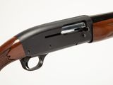 a close up of a shotgun on a white background
