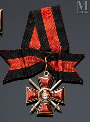 an image of a red and black cross medal with a ribbon around it