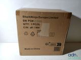 a box that is sitting on a table in front of a white wall
