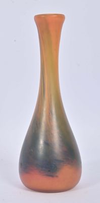 a vase that is sitting on a white surface