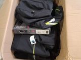 a box full of clothes and a remote in it