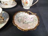 four cups and saucers sitting on a table
