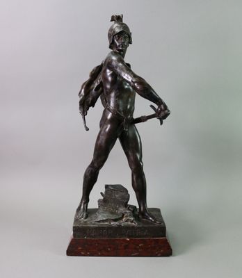 bronze statue of a man holding a bow and arrow on a marble base