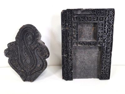 pair of black carved indian figurines of ganesha and ganesha