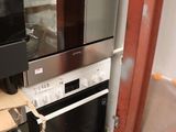 two ovens that are sitting in a room