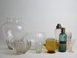 a lot of glass items that are sitting on a table