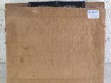 a cardboard box with a piece of paper sticking out of it
