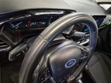 a close up of a steering wheel and dashboard of a car