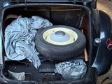 a car with a tire in the trunk of it