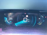 the dashboard of a car with a digital display on it