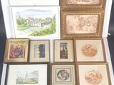 a lot of framed pictures and pictures on the table