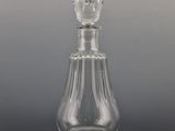 a clear glass bottle with a clear top on a table
